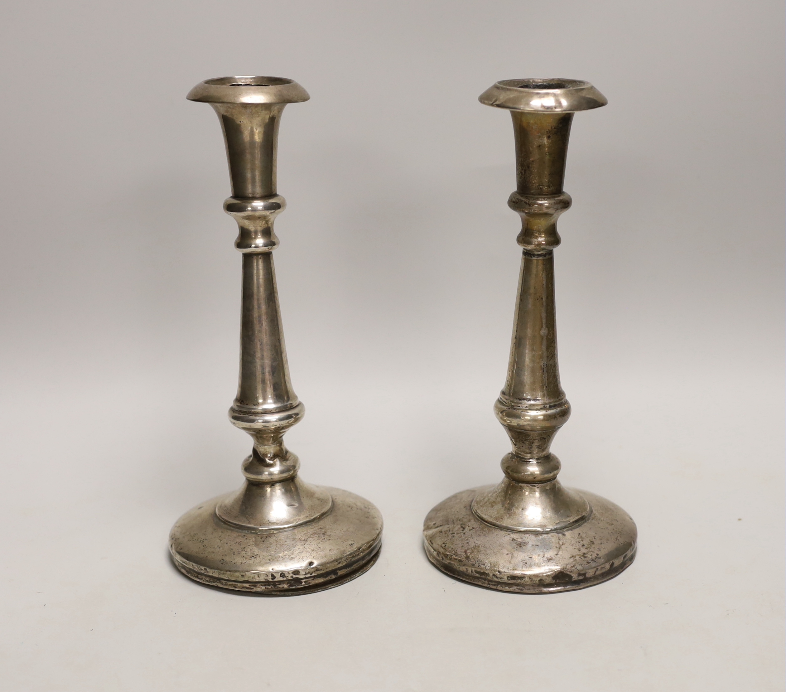 A pair of George V silver candlesticks (a.f.), William Neale & Son, Birmingham, 1912, height 23.5cm, weighted.